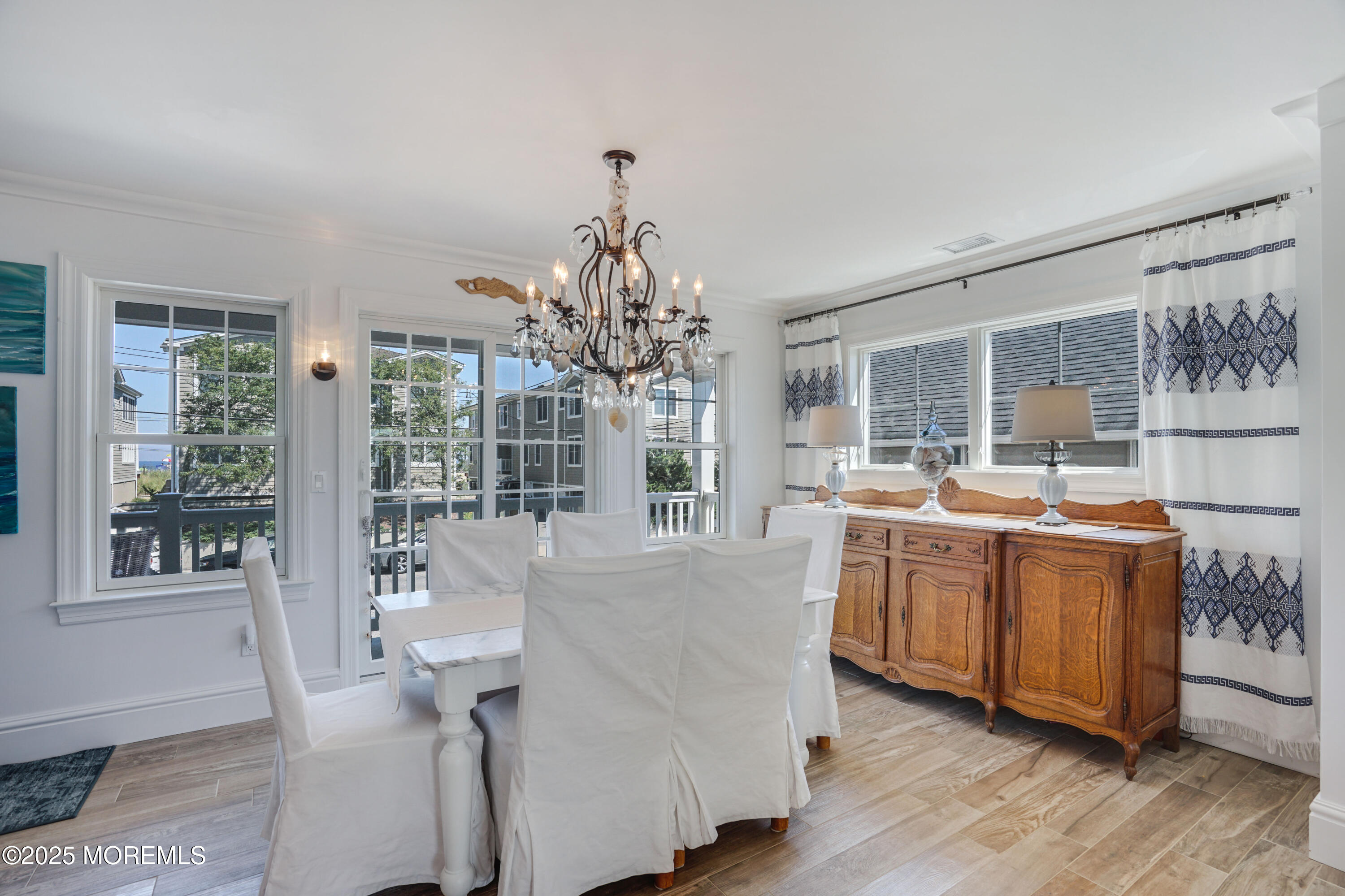 229 1st Avenue Manasquan, NJ 08736 - Photo 8 of 32 a living room with stainless steel appliances granite countertop furniture and wooden floor