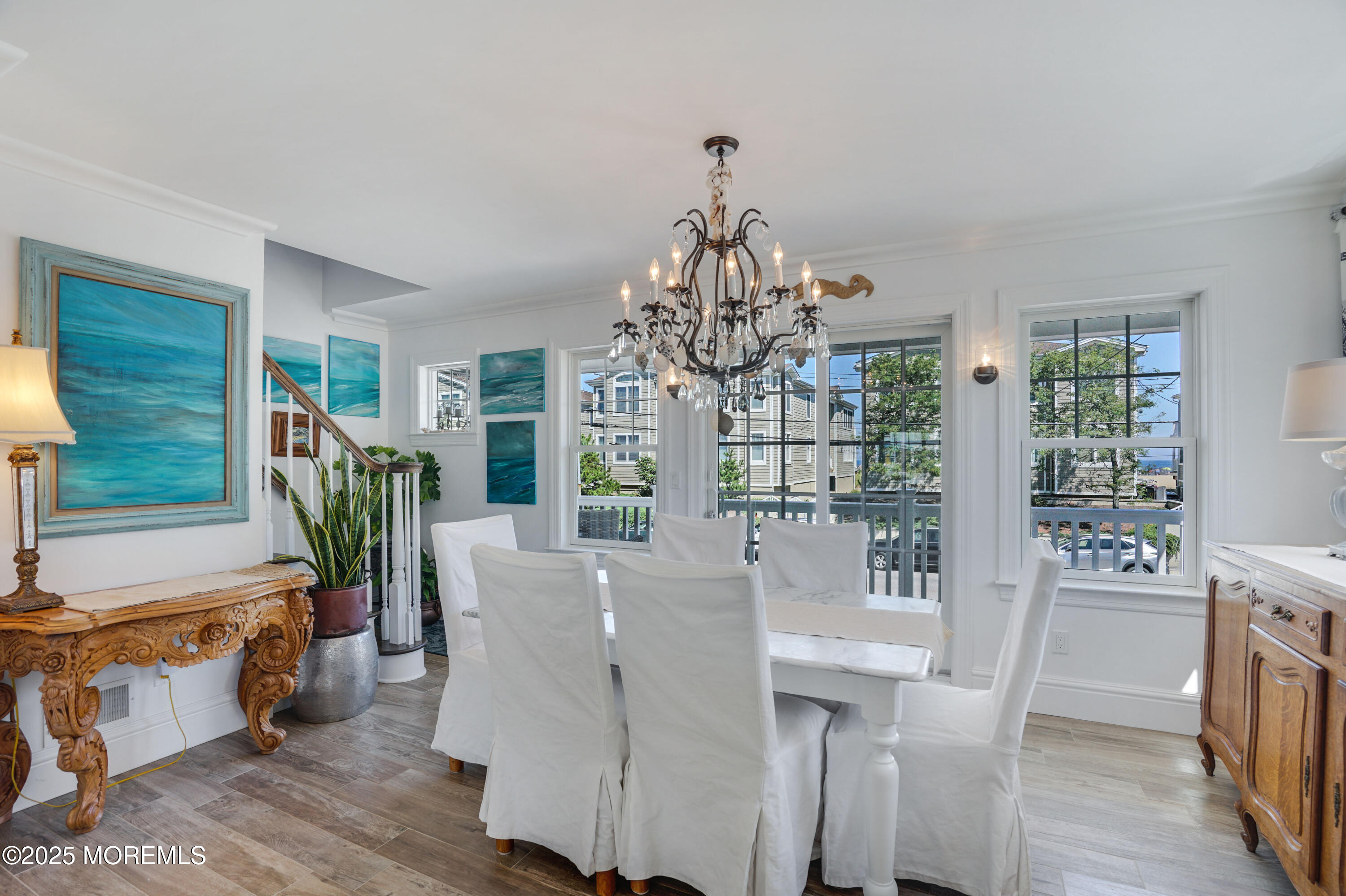 229 1st Avenue Manasquan, NJ 08736 - Photo 9 of 32 a view of a dining room with furniture wooden floor and chandelier
