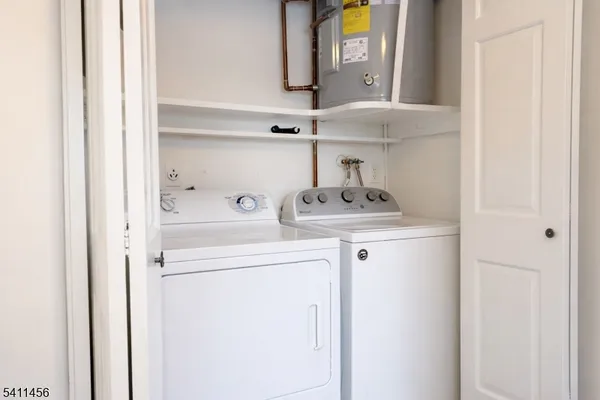 a kitchen with a refrigerator and cabinets