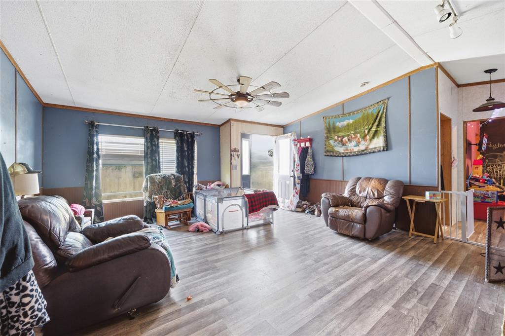 2449 East Fm 120 Denison, TX 75021 - Photo 19 of 30 a living room with furniture and wooden floor