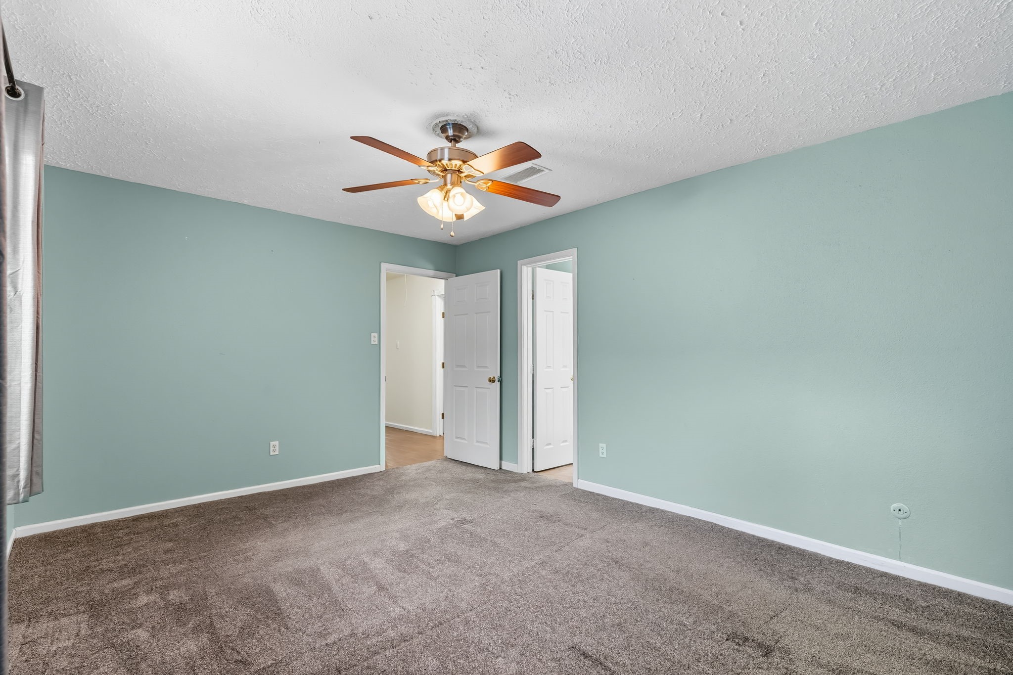 9731 Shell Rock Road La Porte, TX 77571 - Photo 16 of 25 an empty room with a window and a fan
