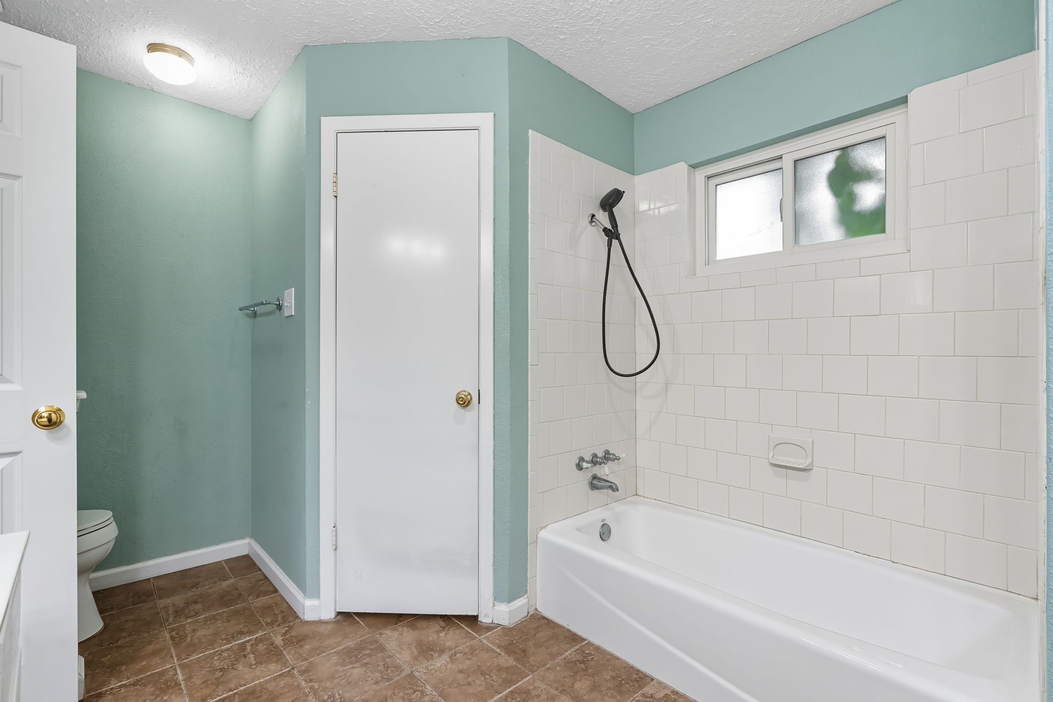 9731 Shell Rock Road La Porte, TX 77571 - Photo 20 of 25 a bathroom with a bath tub and a shower