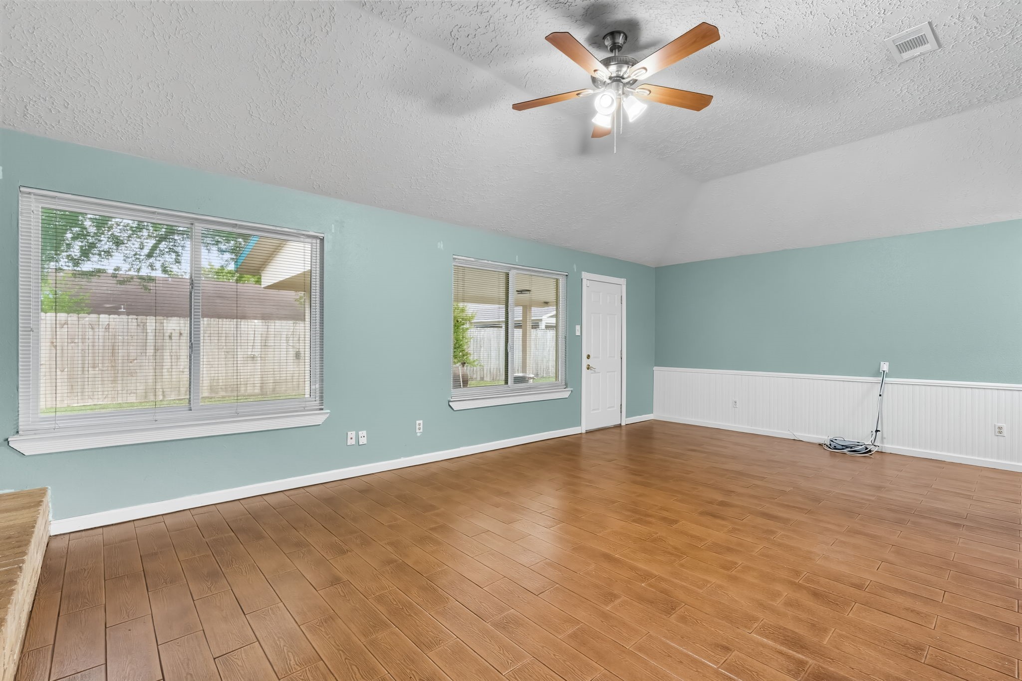 9731 Shell Rock Road La Porte, TX 77571 - Photo 5 of 25 a view of an empty room with chandelier fan and a window