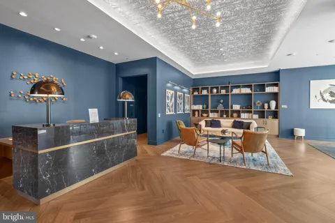 a dining room with furniture and a book shelf