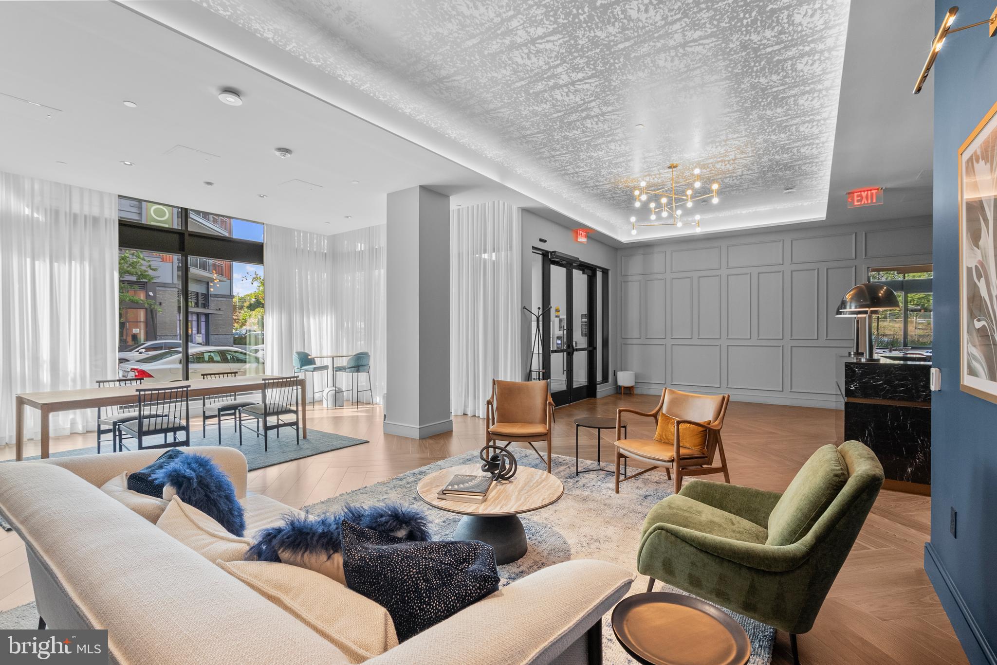 7175 12th Street Northwest, Unit 214 Washington, DC 20012 - Photo 35 of 49 a living room with furniture and wooden floor
