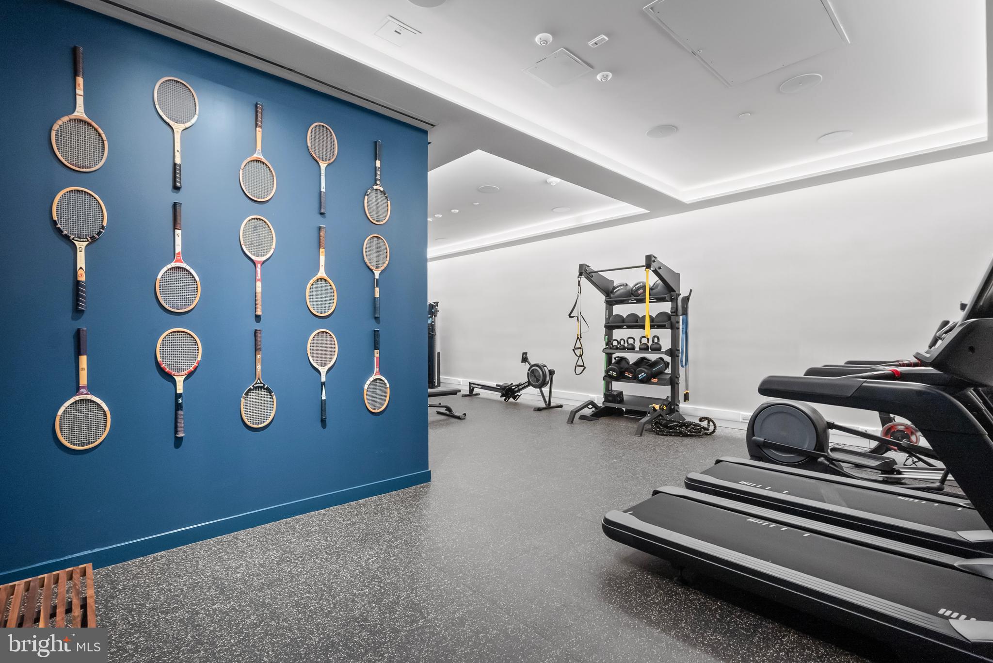 7175 12th Street Northwest, Unit 214 Washington, DC 20012 - Photo 40 of 49 a bedroom with a bed and a large mirror