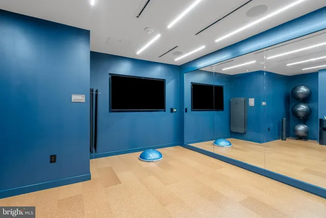 a living room with furniture window and wooden floor