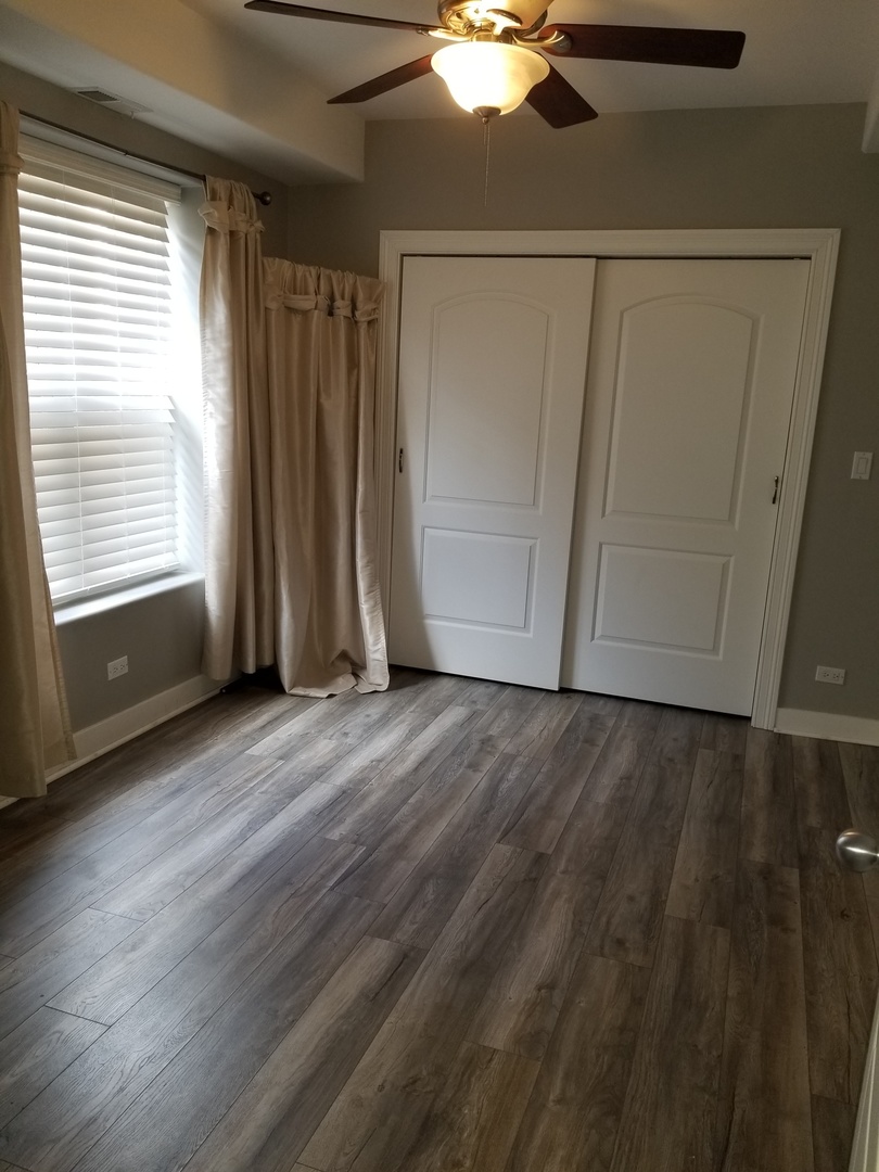 4335 West Irving Park Road, Unit 106 Chicago, IL 60641 - Photo 9 of 12 a view of an empty room with a window