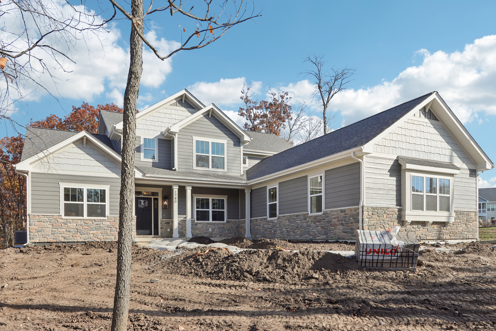 39-w910 Catlin Square Geneva, IL 60134 - Photo 1 of 18 a front view of a house with a yard