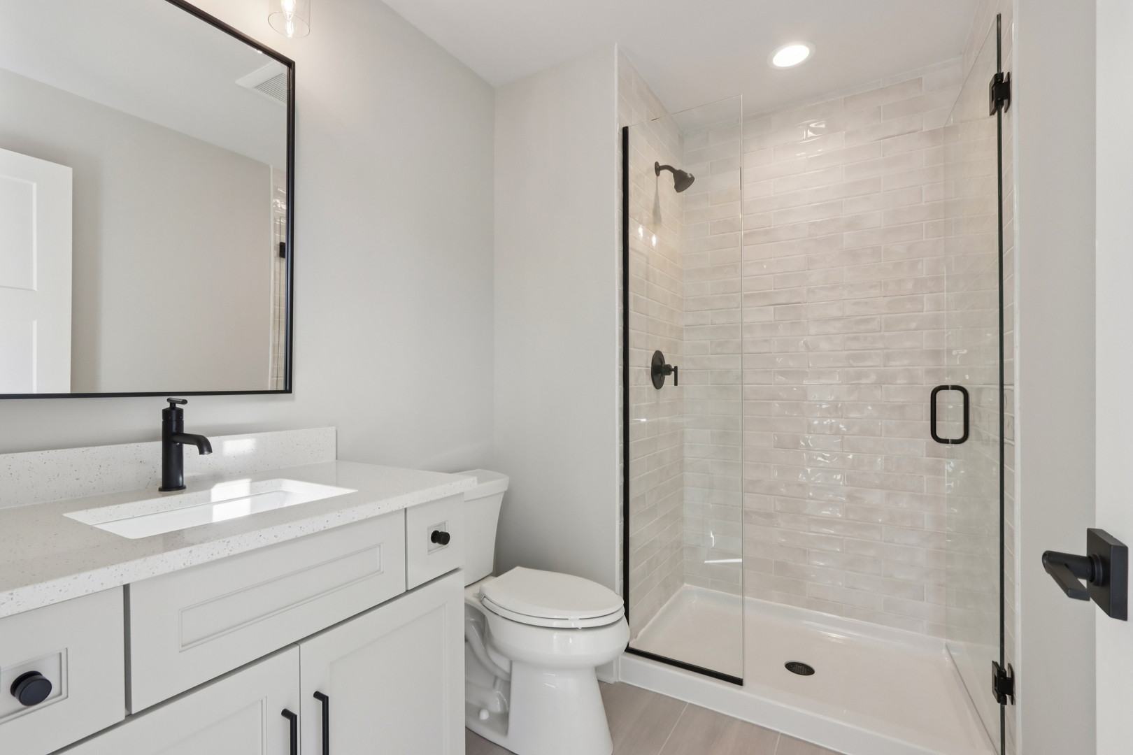 39-w910 Catlin Square Geneva, IL 60134 - Photo 15 of 18 a bathroom with a sink toilet and shower