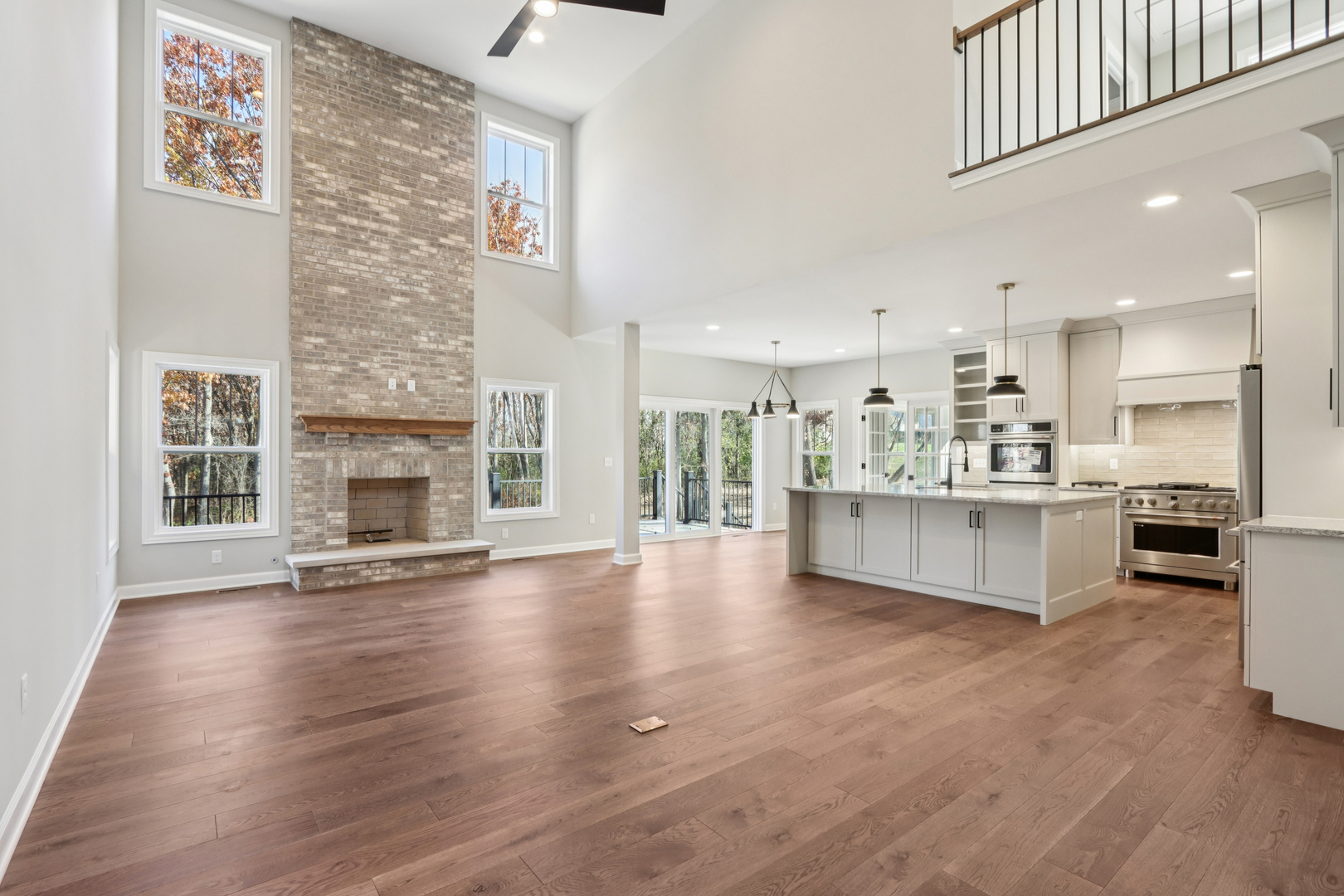 39-w910 Catlin Square Geneva, IL 60134 - Photo 5 of 18 a large white kitchen with a large window and stainless steel appliances