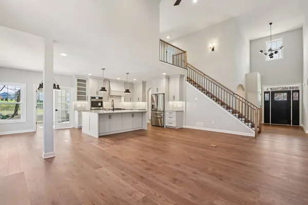 a view of kitchen with furniture and wooden floor