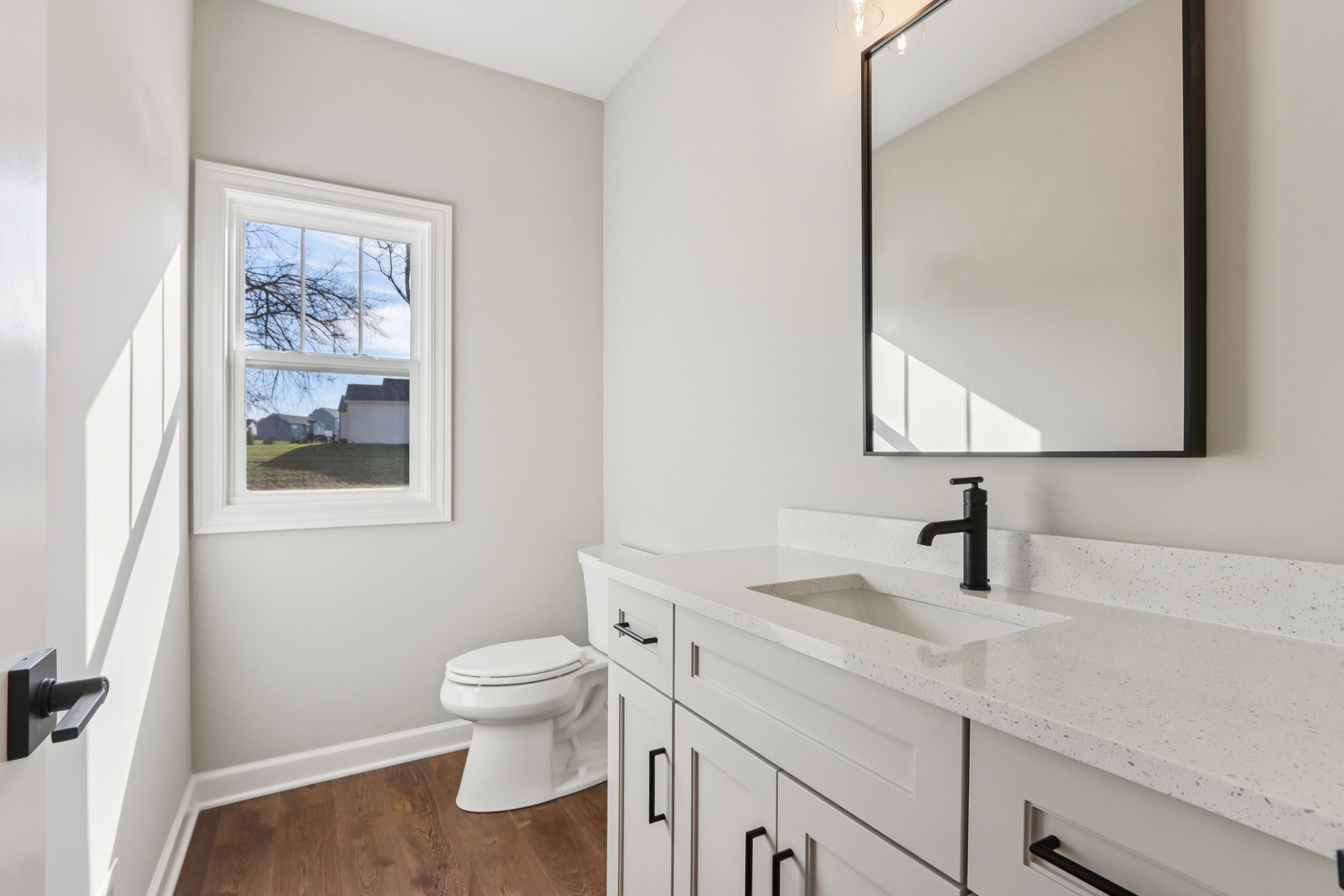 39-w910 Catlin Square Geneva, IL 60134 - Photo 8 of 18 a bathroom with a toilet a sink and mirror