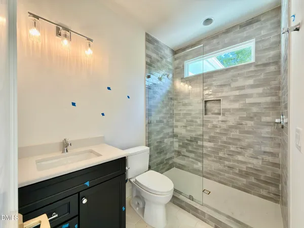 a bathroom with a bathtub and shower