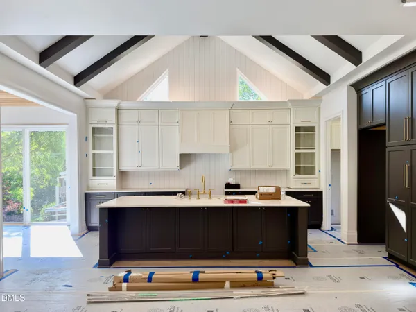 a kitchen with a stove and a sink