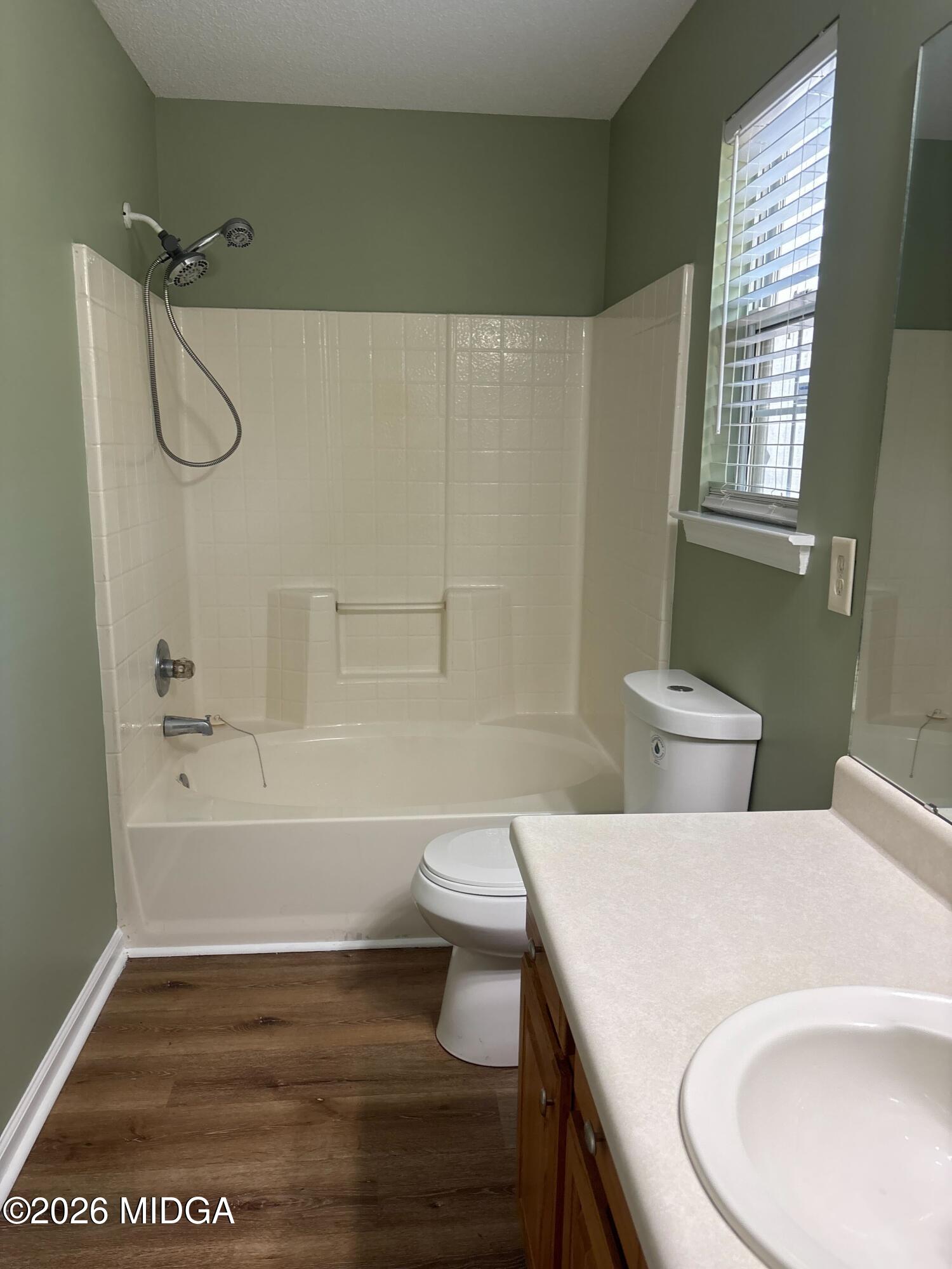 404 Dunmurry Place Warner Robins, GA 31093 - Photo 11 of 18 a bathroom with a sink a toilet and bathtub