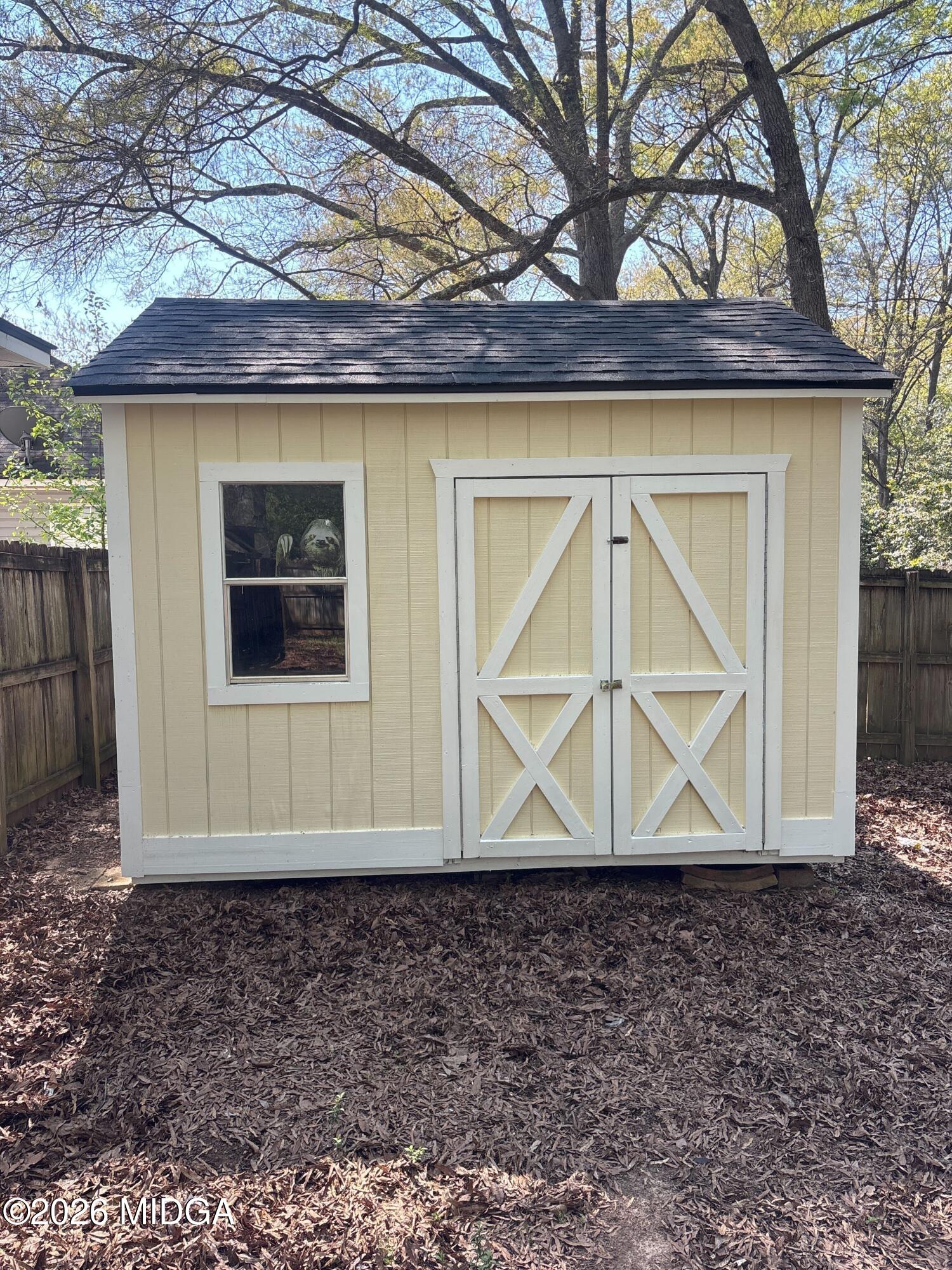 404 Dunmurry Place Warner Robins, GA 31093 - Photo 16 of 18 a view of house with a wooden fence and a wooden fence