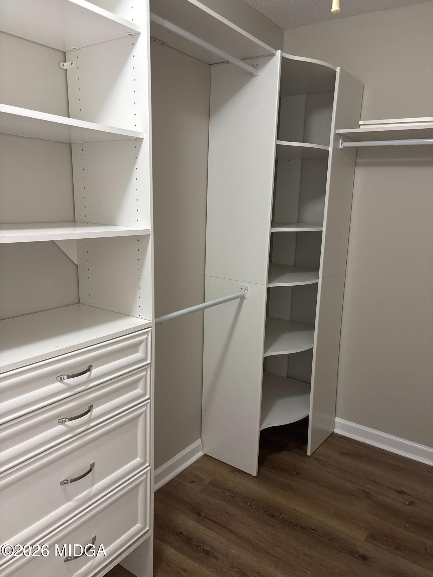 404 Dunmurry Place Warner Robins, GA 31093 - Photo 10 of 18 a view of walk in closet with empty racks