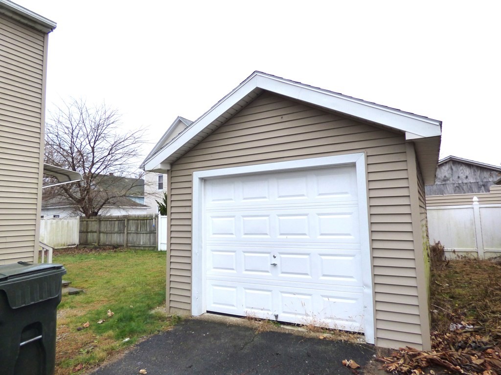 48 Enfield Street Springfield, MA 01151 - Photo 3 of 20 a front view of a house with a yard