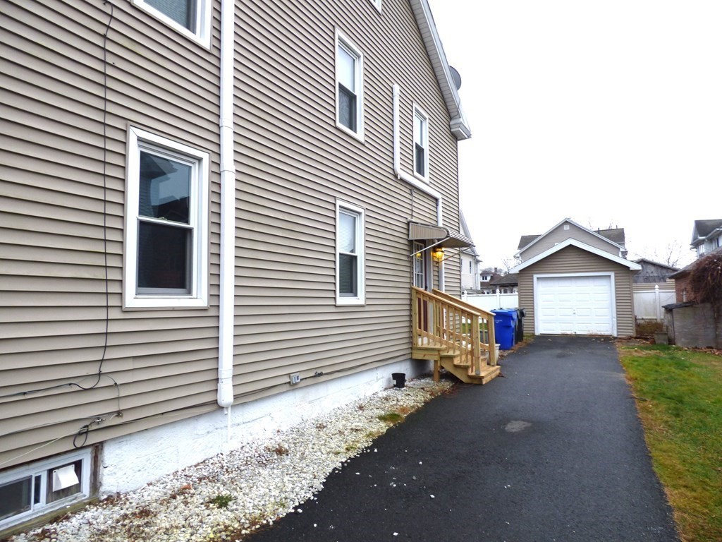 48 Enfield Street Springfield, MA 01151 - Photo 8 of 20 a front view of a house with a yard