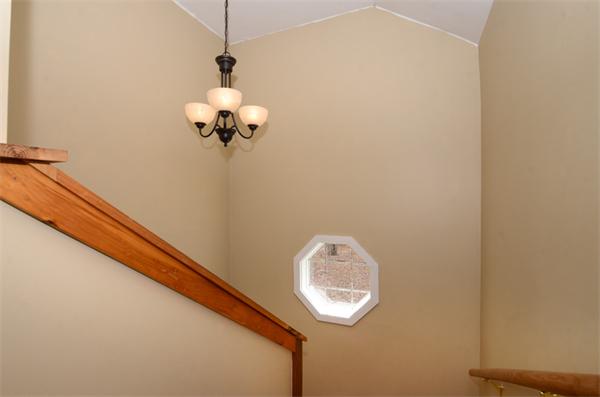 8 Belmore Road Merrimac, MA 01860 - Photo 14 of 22 a view of a hallway with a chandelier