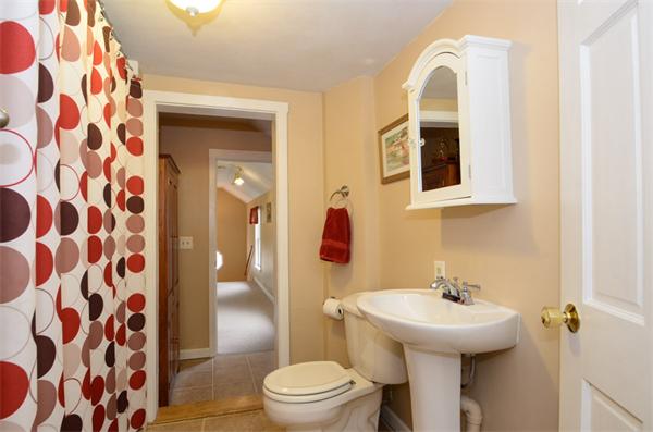 8 Belmore Road Merrimac, MA 01860 - Photo 15 of 22 a bathroom with a sink and mirror with toilet