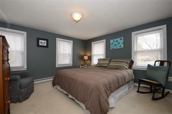 8 Belmore Road Merrimac, MA 01860 - Photo 16 of 22 a bedroom with a bed and a couch next to a window