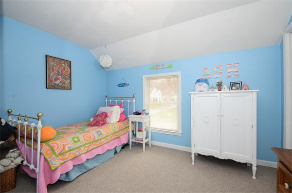 8 Belmore Road Merrimac, MA 01860 - Photo 17 of 22 a bedroom with a bed and a baby crib