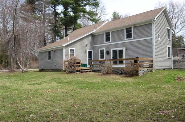 8 Belmore Road Merrimac, MA 01860 - Photo 2 of 22 a backyard of a house with barbeque oven and outdoor seating