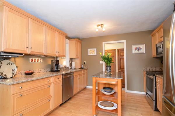 8 Belmore Road Merrimac, MA 01860 - Photo 4 of 22 a kitchen with stainless steel appliances granite countertop a stove a sink and a refrigerator