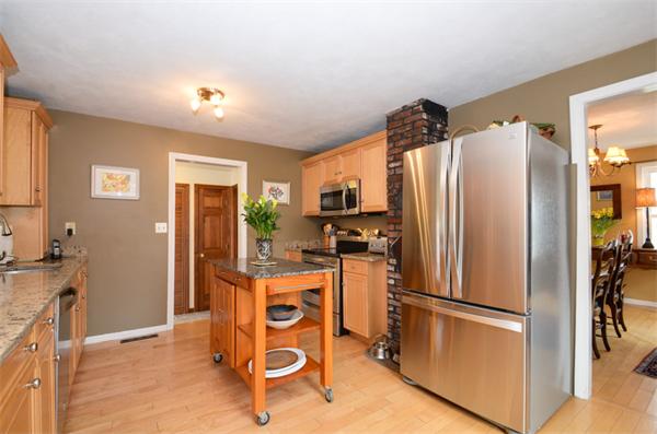 8 Belmore Road Merrimac, MA 01860 - Photo 5 of 22 a kitchen with stainless steel appliances a refrigerator and a stove top oven