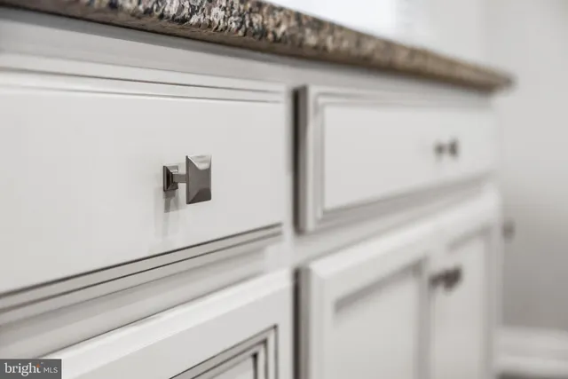 a kitchen with stainless steel appliances a stove and a microwave