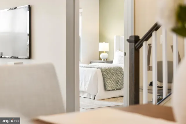 a bedroom with bed and a window