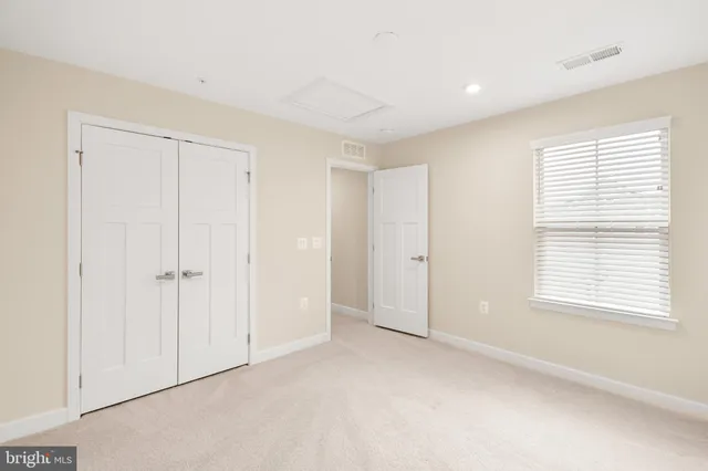 a bathroom with a double vanity sink toilet and shower