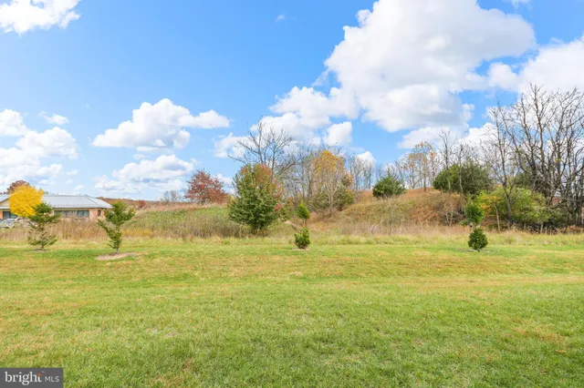a view of a building with a big yard