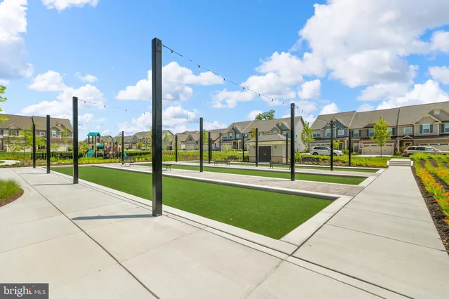 a view of a garden with sitting area