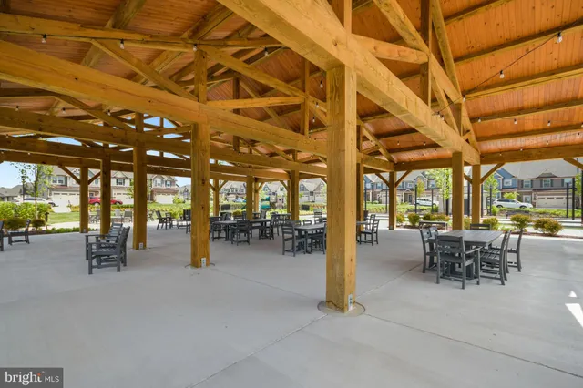 a view of a swimming pool and trees in the background