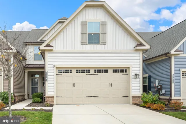 a front view of a house with a garage