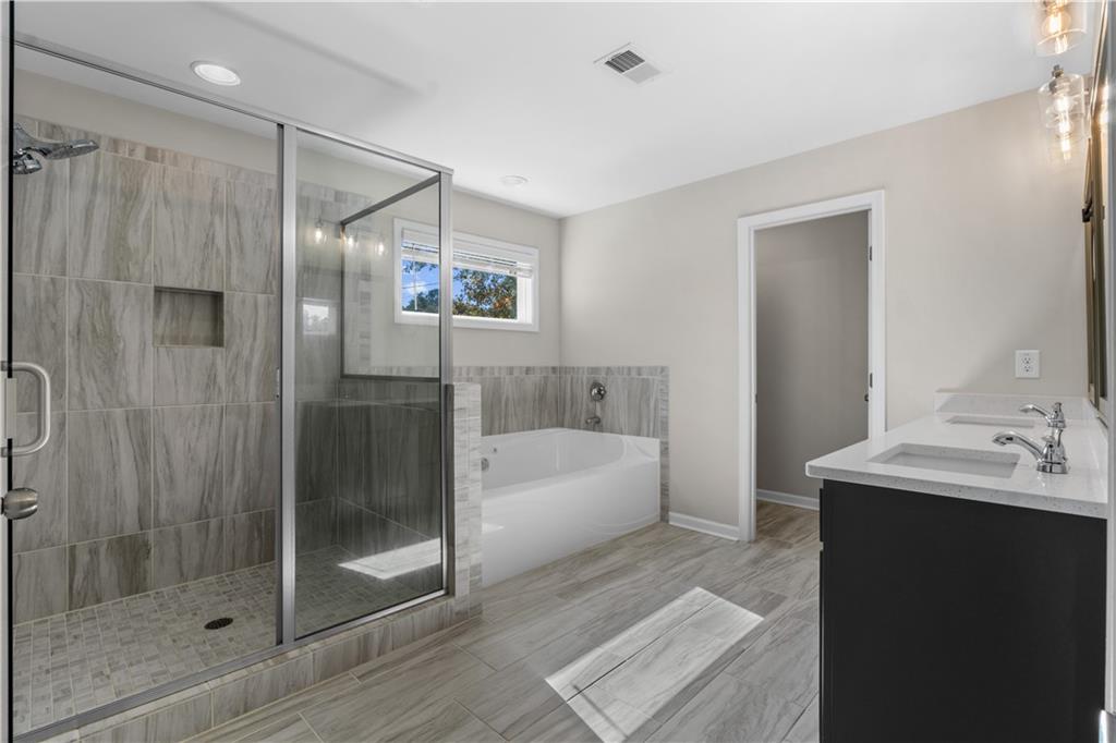 150 Cedar Pk Way Carrollton, GA 30117 - Photo 21 of 37 a bathroom with a shower a bathtub and a sink