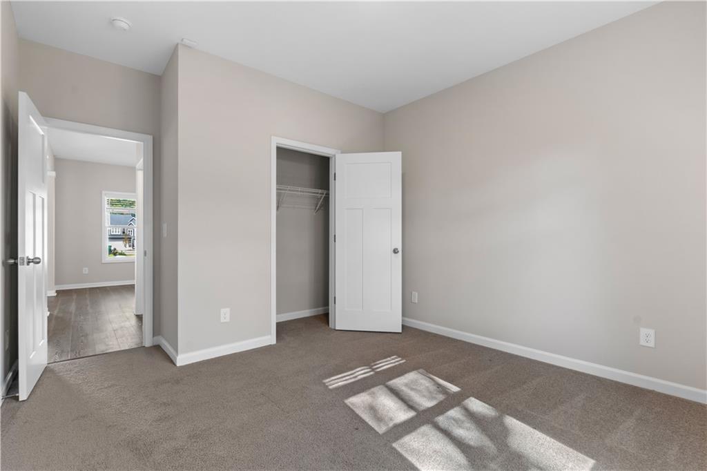 150 Cedar Pk Way Carrollton, GA 30117 - Photo 30 of 37 an empty room with windows and closet