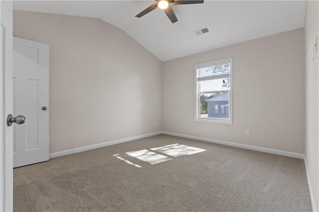 150 Cedar Pk Way Carrollton, GA 30117 - Photo 31 of 37 an empty room with windows and fan
