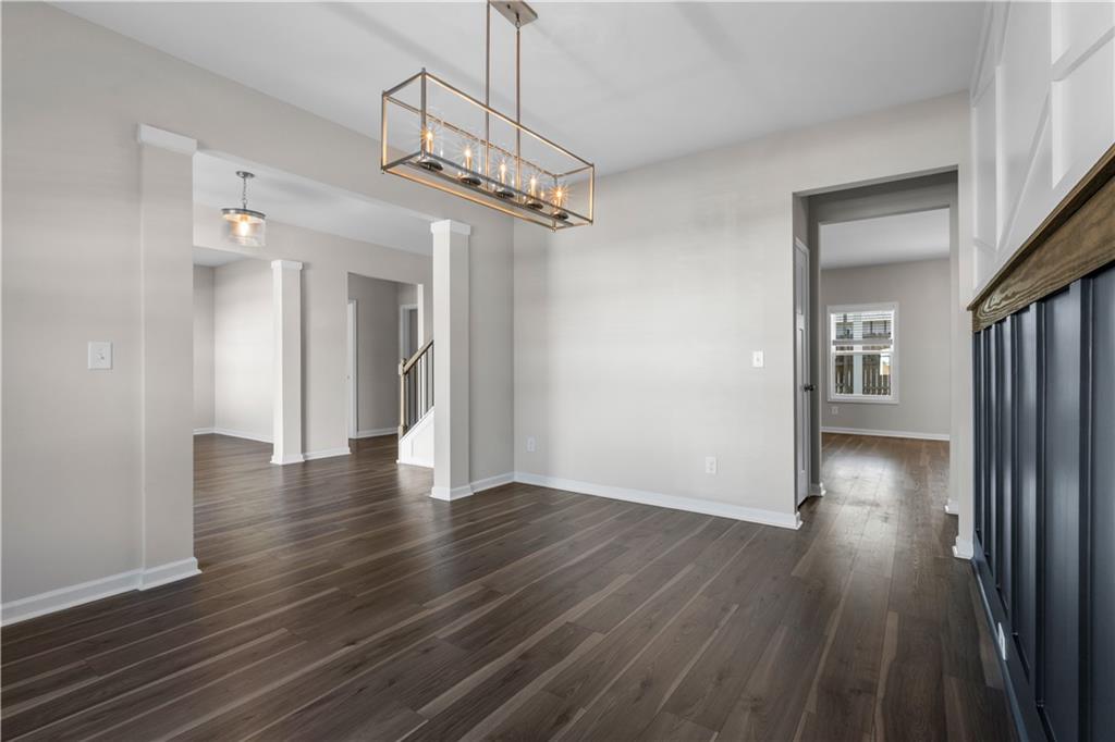 150 Cedar Pk Way Carrollton, GA 30117 - Photo 5 of 37 a view of a hallway with wooden floor and a chandelier