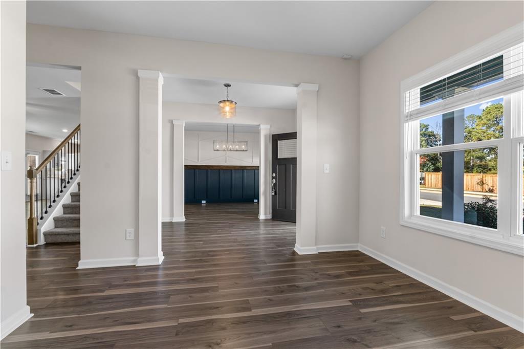 150 Cedar Pk Way Carrollton, GA 30117 - Photo 6 of 37 a view of empty room with wooden floor and fan