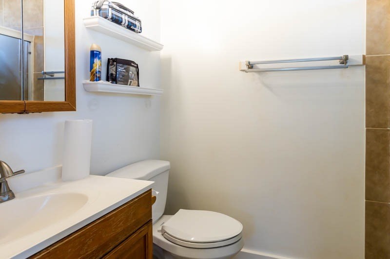 4541 Panihi Road Kapaa, HI 96746 - Photo 13 of 30 a white toilet sitting next to a bathroom sink