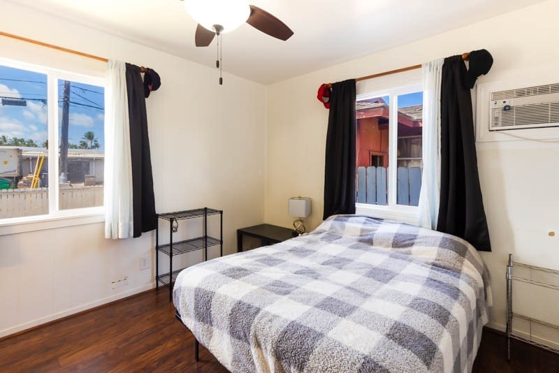 4541 Panihi Road Kapaa, HI 96746 - Photo 9 of 30 a bedroom with a bed and a large window