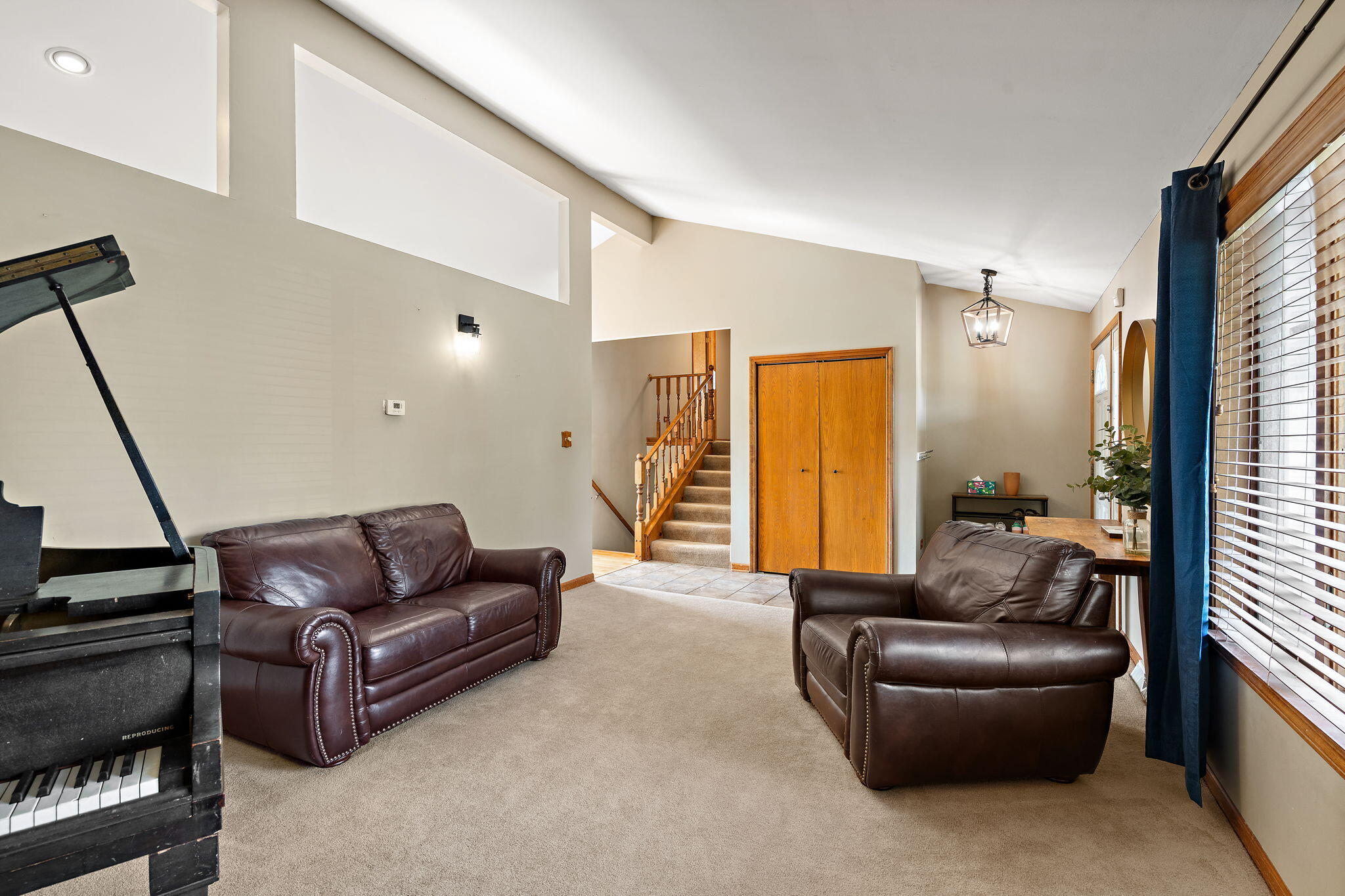 8987 Calhoun Place Crown Point, IN 46307 - Photo 6 of 28 a living room with furniture and a couch
