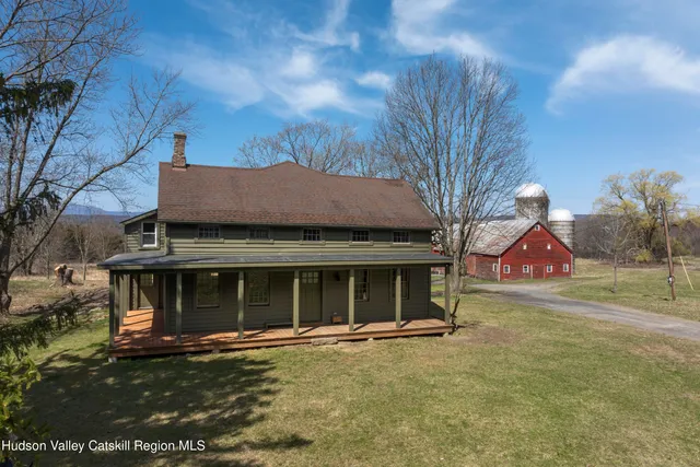 a view of a house with a yard and garage
