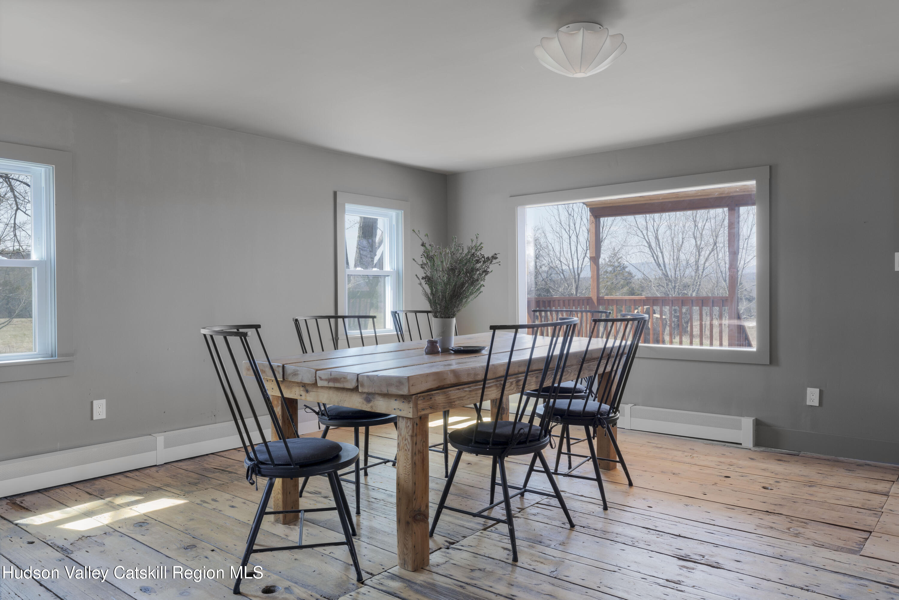 857 Flats Road Athens, NY 12015 - Photo 12 of 30 a view of a dining room with furniture window and wooden floor