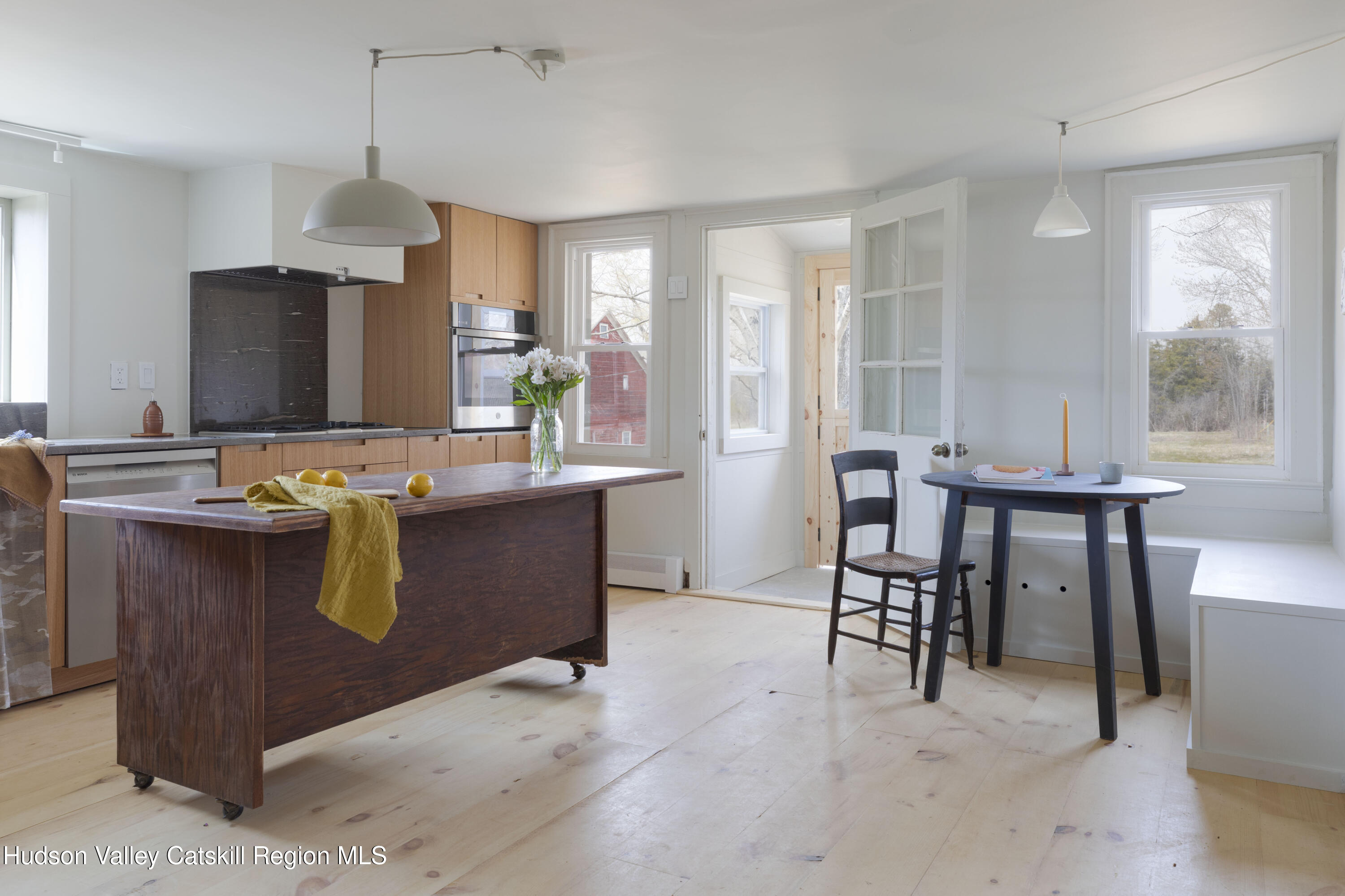 857 Flats Road Athens, NY 12015 - Photo 18 of 30 a dining room with furniture and a flat screen tv