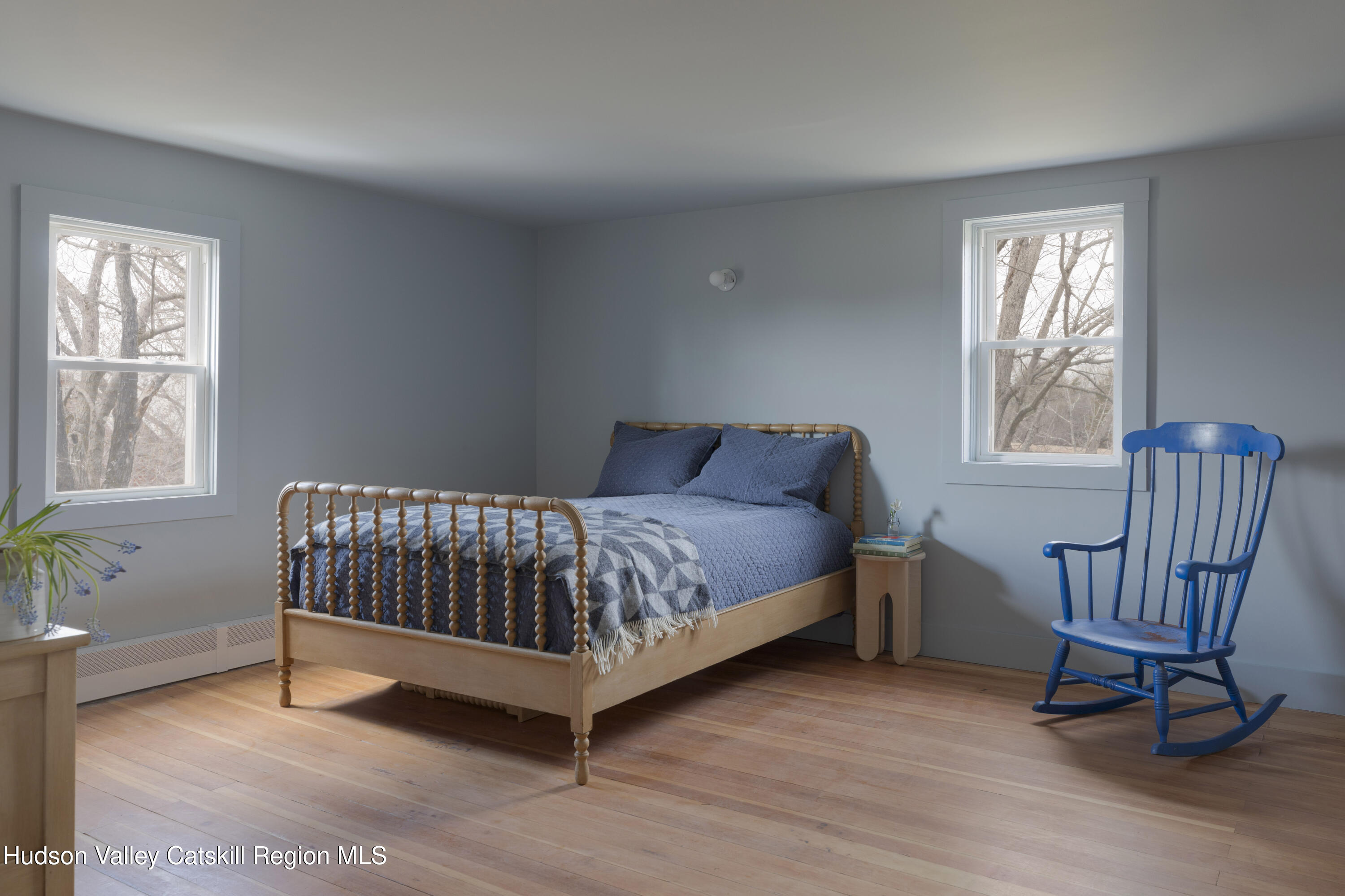 857 Flats Road Athens, NY 12015 - Photo 21 of 30 a bedroom with a bed chair and two windows